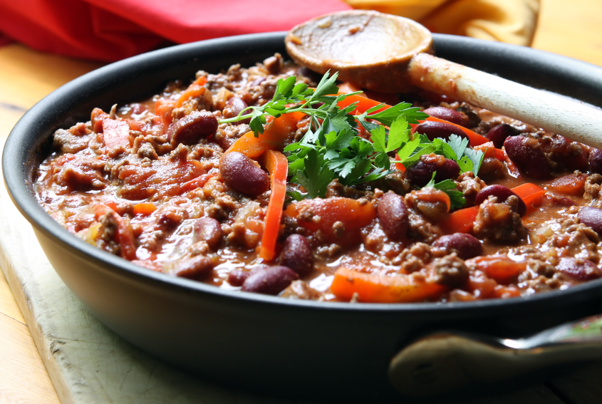 A pan of chilli, ready to serve. Soft focus, shallow depth of field.